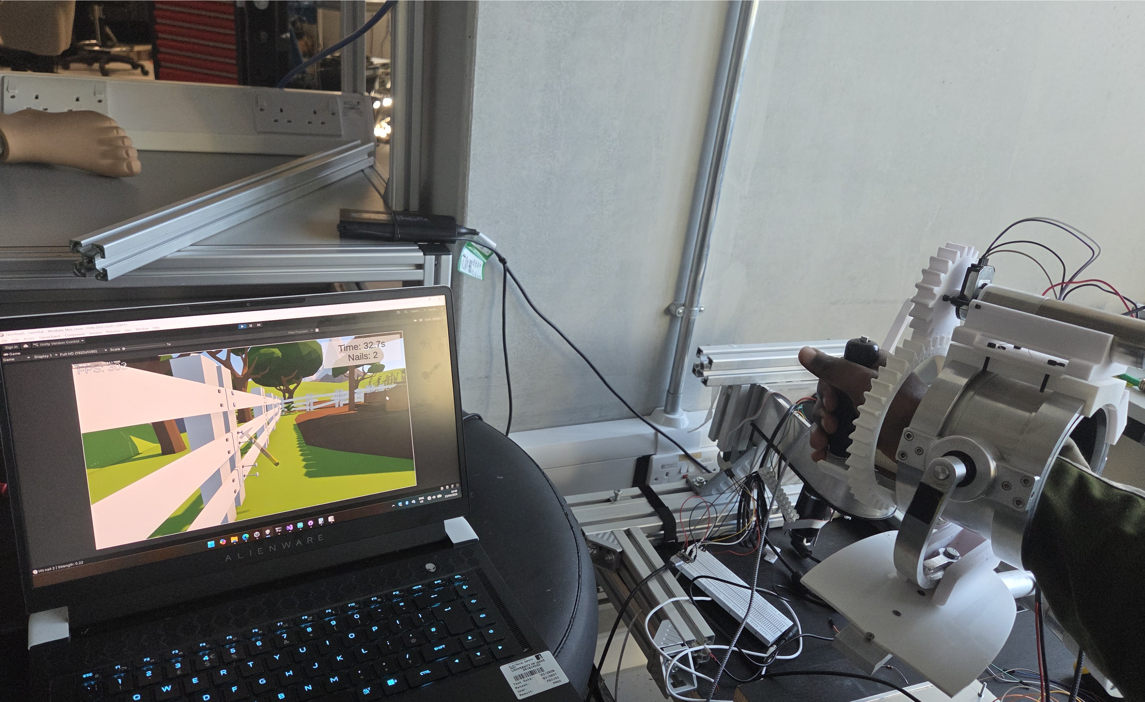 Robot hardware operating alongside a Unity rehabilitation exercise