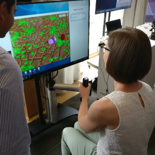 Participant using neurological rehabilitation technology in a research setting